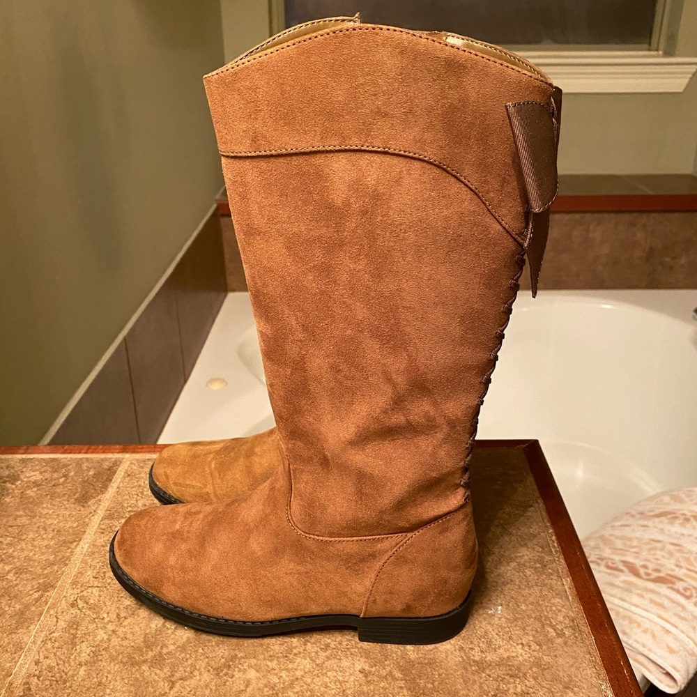 Kenneth Cole boots with bow on the back.